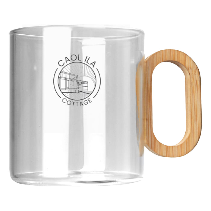 Cottage Glass Coffee Cup - A transparent glass coffee cup with a bamboo handle and a circular logo on the side.
