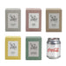 Mini East 42nd Street Can Candle - A set of six square candle boxes in various pastel colours: coconut milk and saffron, vanilla caramel, chocolate espresso, cinnamon and clove, eucalyptus and lemon myrtle. A Coca-Cola can is beside them.