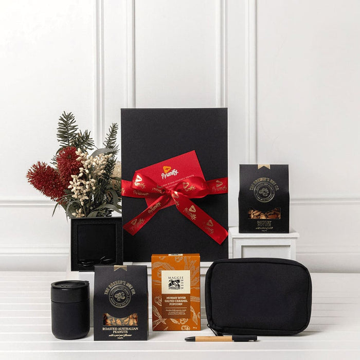Branded Tech Kit Gift Pack - A black gift box tied with a red ribbon, containing coffee packets, a black mug, a pouch, and a pen.