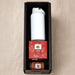 Festive Essentials Set - A white drink bottle, Christmas pudding box, and a small jar in a black gift box.