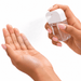 Scented 35ml Spray Sanitiser - A clear 35ml spray sanitiser with a white nozzle is being applied to a hand.