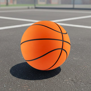 High Bounce Basket Ball - An orange basketball with black lines resting on a concrete surface in a sports court setting.