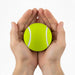 High Bounce Tennis Ball - A bright yellow tennis ball is held gently between two hands. The ball features white stripes.