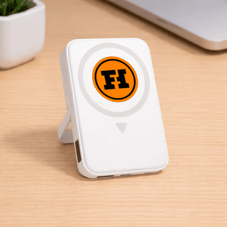 The Mellany 15W Wireless Charging Powerbank 10,000mAh - A white wireless charging powerbank with a logo, featuring a built-in stand and two USB ports.