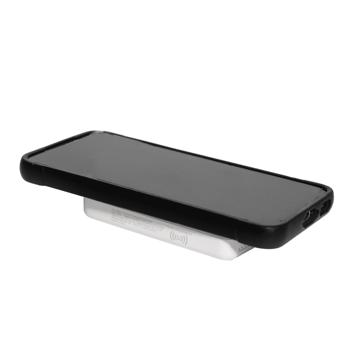The Mason Wireless Charging Powerbank 5000mAh - A wireless charging power bank in white with a sleek design supporting a black smartphone on top.