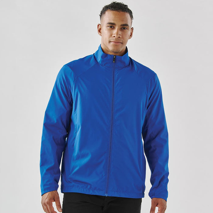 Men's Pacifica Full Zip Jacket - A man wearing a vibrant blue full zip rain jacket. The jacket features a collar and a logo.