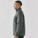 Men's Pacifica Thermal Jacket - A side view of a man wearing a men's thermal jacket in a dark green colour. The jacket features a high collar and has a logo.