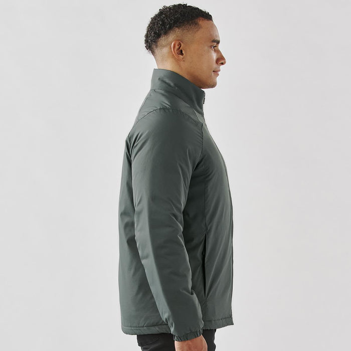 Men's Pacifica Thermal Jacket - A men's thermal jacket in dark green, featuring a high collar and a sleek, fitted design. It has a logo on it.