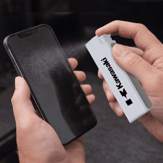 The Wipey Screen Cleaner - A white spray bottle is cleaning a smartphone screen, which is covered in mist. The bottle has a logo.
