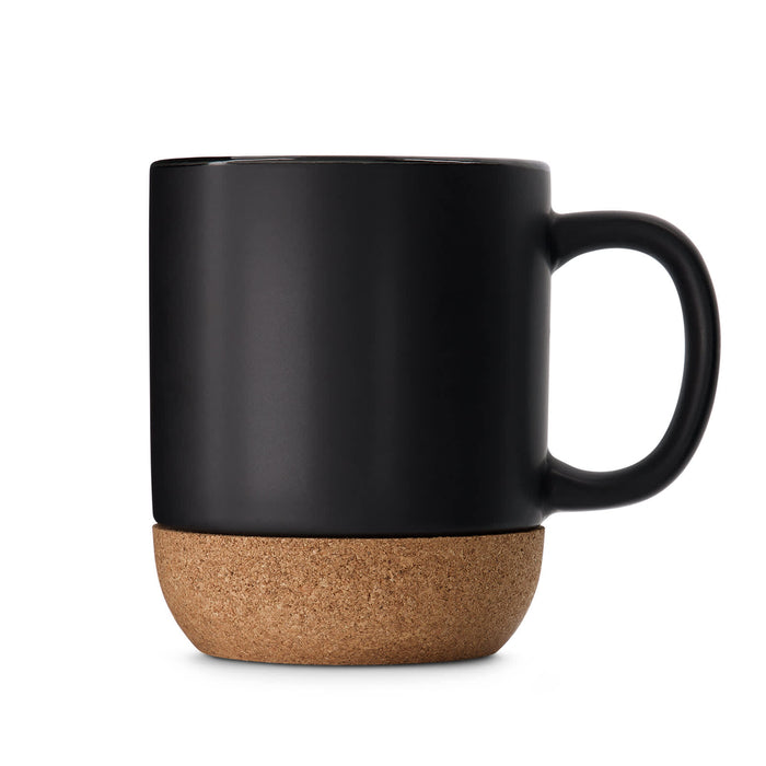 The Cosy Indulgence - A ceramic mug with a matte black finish and a cork base. It features a single handle and branding.