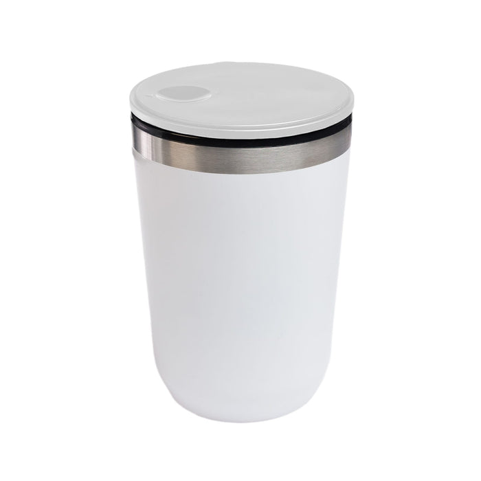 The Pause Pack - A reusable coffee cup featuring a sleek white design with a stainless steel accent and a secure lid.