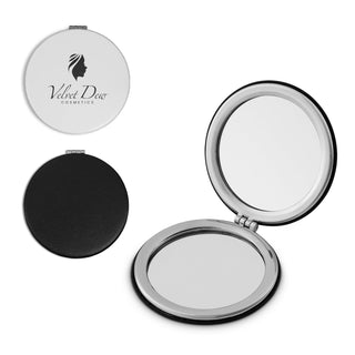 Finesse Compact Mirror - A compact mirror with a shiny silver exterior and a black interior, featuring a logo on the front.