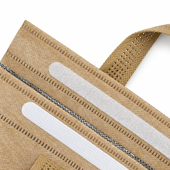 Wayfarer Cooler Bag - A tan cooler bag featuring textured elements and white detailing. The bag has a handle and a logo.