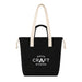 Darby Tote Bag - A black tote bag with cream handles and a front pocket, featuring a logo on the front.
