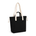 Darby Tote Bag - A black tote bag with cream straps and a front pocket, featuring a drawstring closure.
