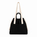 Darby Tote Bag - A black tote bag with a drawstring closure, featuring a front pocket and dual straps in a contrasting colour.