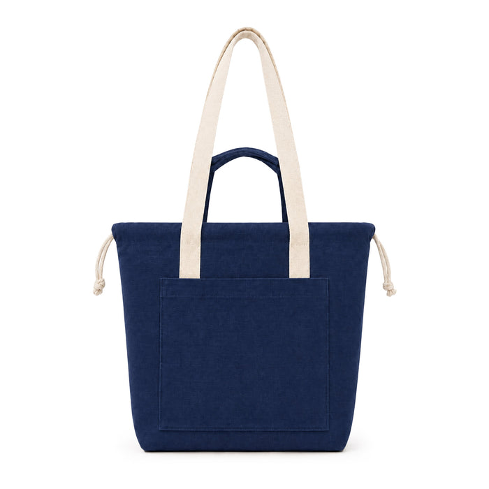 Darby Tote Bag - A navy blue tote bag with cream handles and a front pocket, featuring a logo on the front.