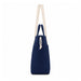 Darby Tote Bag - A navy tote bag with cream handles and a drawstring closure, featuring a subtle logo.