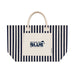 Hampton Tote Bag by The Line Edit. - A striped navy and cream tote bag featuring a front pocket and handles, with a logo on the pocket.