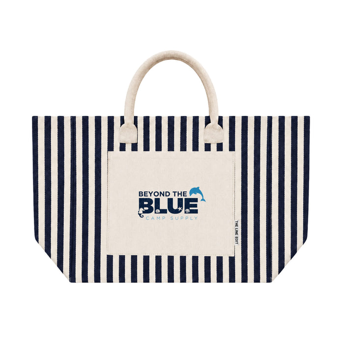 Hampton Tote Bag by The Line Edit. - A striped tote bag in navy and cream with a front pocket and a branded logo.