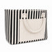 Hampton Tote Bag by The Line Edit. - A striped tote bag with black and cream colours, featuring a front pocket and two top handles.