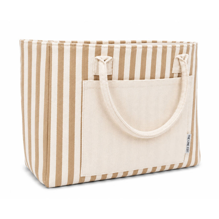 Hampton Tote Bag by The Line Edit. - A tote bag with brown and cream stripes, featuring a front pocket and two sturdy handles. It has a logo on the side.