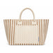 Hampton Tote Bag by The Line Edit. - A striped tote bag in beige and cream featuring two handles and a front pocket. Branding is present on the bag.