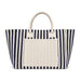 The Weekend Edit - A navy and cream striped tote bag with two sturdy handles and a front pocket. It features a branding logo.