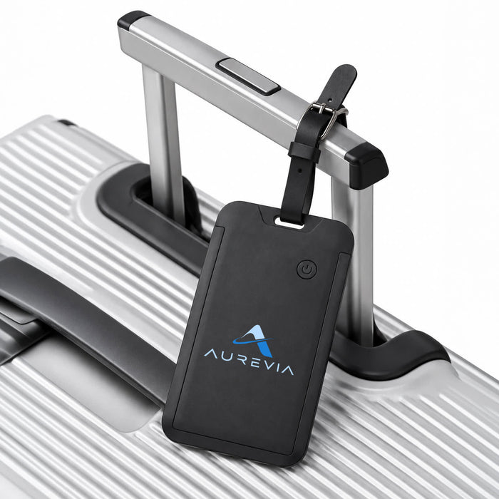 Jet Luggage Tag Tracker - A black luggage tag tracker attached to the handle of a silver suitcase, featuring a logo.