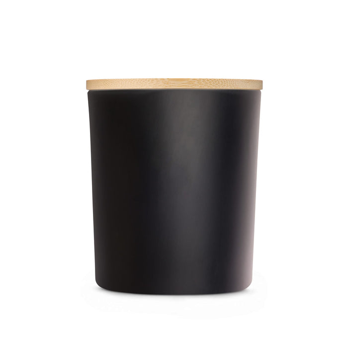 The Brew Ritual - A large black glass candle with a smooth finish and a bamboo lid. Minimalistic design with a sleek appearance.