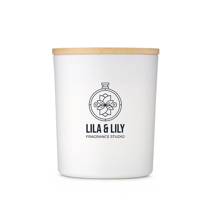 The Brew Ritual - A large white glass candle with a wooden lid and a logo, featuring a floral design.