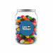 Assorted Jelly Beans in Clear Can 210g - A clear jar filled with assorted jelly beans in vibrant colours, featuring a label with a logo.