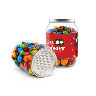 M&M's in Clear Can 180g - A clear canister filled with colourful M&M's, featuring a playful design and a logo on the side.