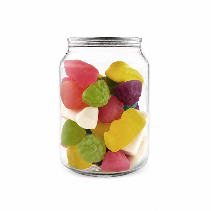 The Good Stuff Pack - A clear canister filled with vibrant jelly sweets in various shapes and colours, including pink, green, and yellow.