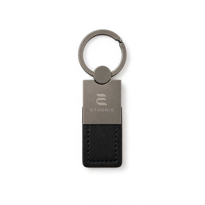 Mario Keytag - A keytag featuring a metal and black leather design, with a circular keyring and a logo.