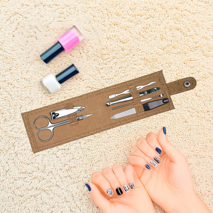Cork Manicure Set - A cork manicure set with scissors, files, and nail polishes in pink and white, displayed on a soft surface.
