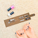 Cork Manicure Set - A cork manicure set with scissors, files, and nail polishes in pink and white, displayed on a soft surface.