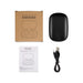 Loop Earbuds - A set of black wireless ear buds inside a charging case, with a USB cable and instruction manual beside them.