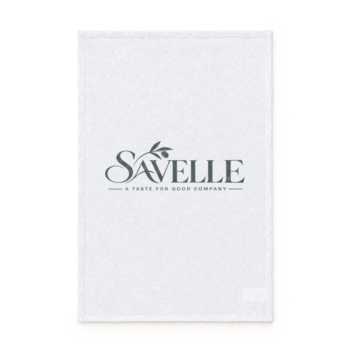 Haven Medium Cotton Tea Towel - A white cotton tea towel with a logo and a simple design featuring a leafy branch.