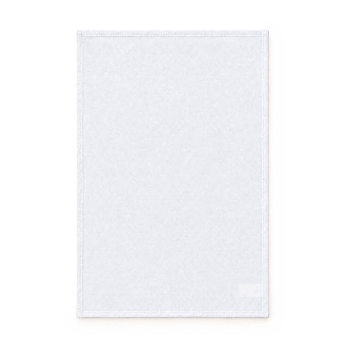 Haven Medium Cotton Tea Towel - A medium cotton tea towel in white, featuring a simple design and an attached logo.