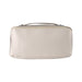 The Polished Traveller - A cream-coloured toiletry bag with a zipper closure and a carrying handle, featuring a logo on the side.