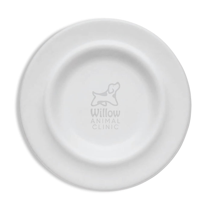 Sip n Fly Pet Bowl - A white pet bowl with a circular design and an embossed logo in the centre.