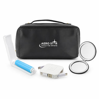 The Polished Traveller - A black cosmetic bag with a logo, containing a roller, a mirror, and a charger.