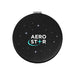 The Polished Traveller - A round, black compact with a starry design and a logo in the centre.