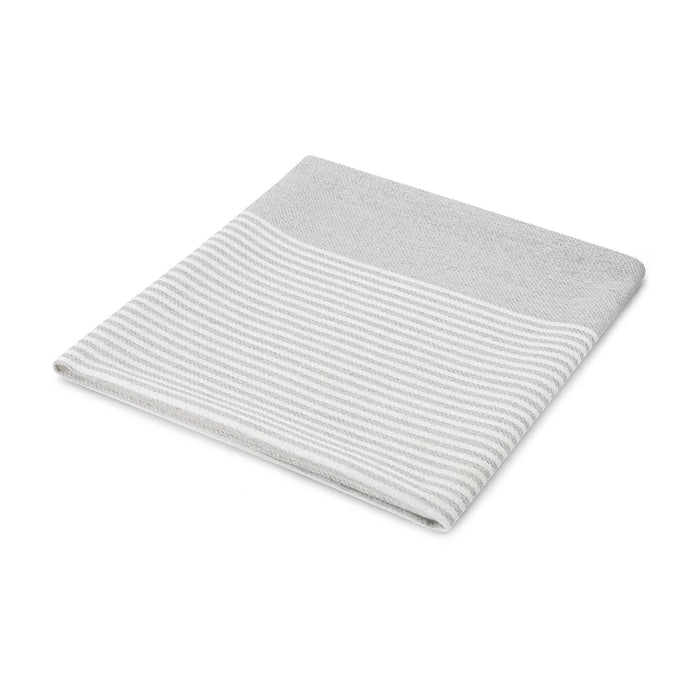 The Glow & Graze: Christmas Edition - A folded grey towel with a striped design at the top. It features a soft texture and a simple, modern look.