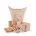 Eco Pack - A mesh bag in cream holds a cream mug, wooden cutting board, pink lunch boxes, and pink cutlery.