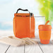 Picnic Pack - An orange picnic pack containing a drink bottle, reusable cup, utensils, and food containers, all in a vibrant setting.