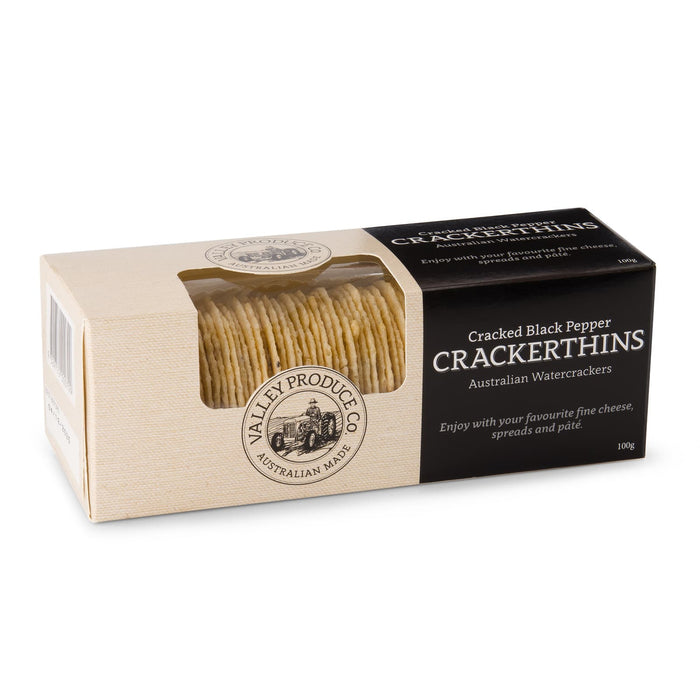 The Good Things - A box of Cracked Black Pepper Crackerthins featuring a stack of thin water crackers. The box has a logo and a beige colour scheme.