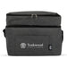 The Winter Warmer Pack - A grey insulated drink cooler with a front pocket and a logo, featuring a zippered top and adjustable strap.