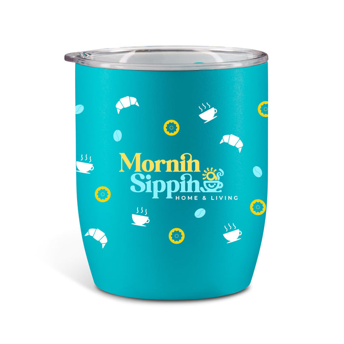 The Refuel Pack - A teal drink cup with a lid, featuring croissant and coffee cup patterns, and a branding logo.